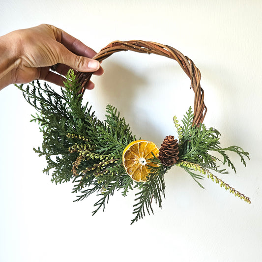 Small cedar, andromeda & orange wreath